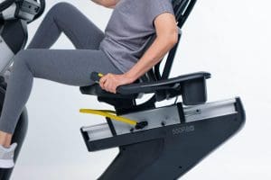 a man sitting on a stationary exercise bike