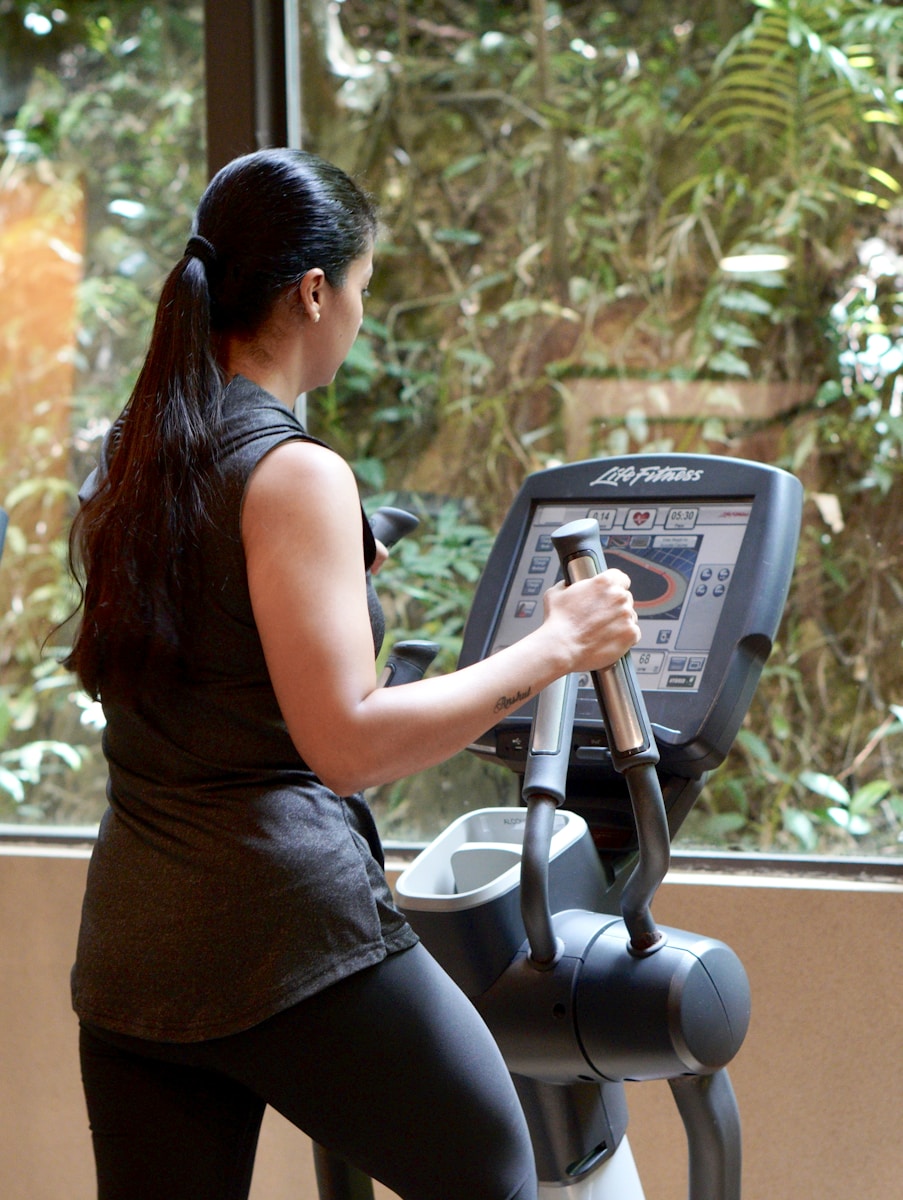 a woman using a weight machine
