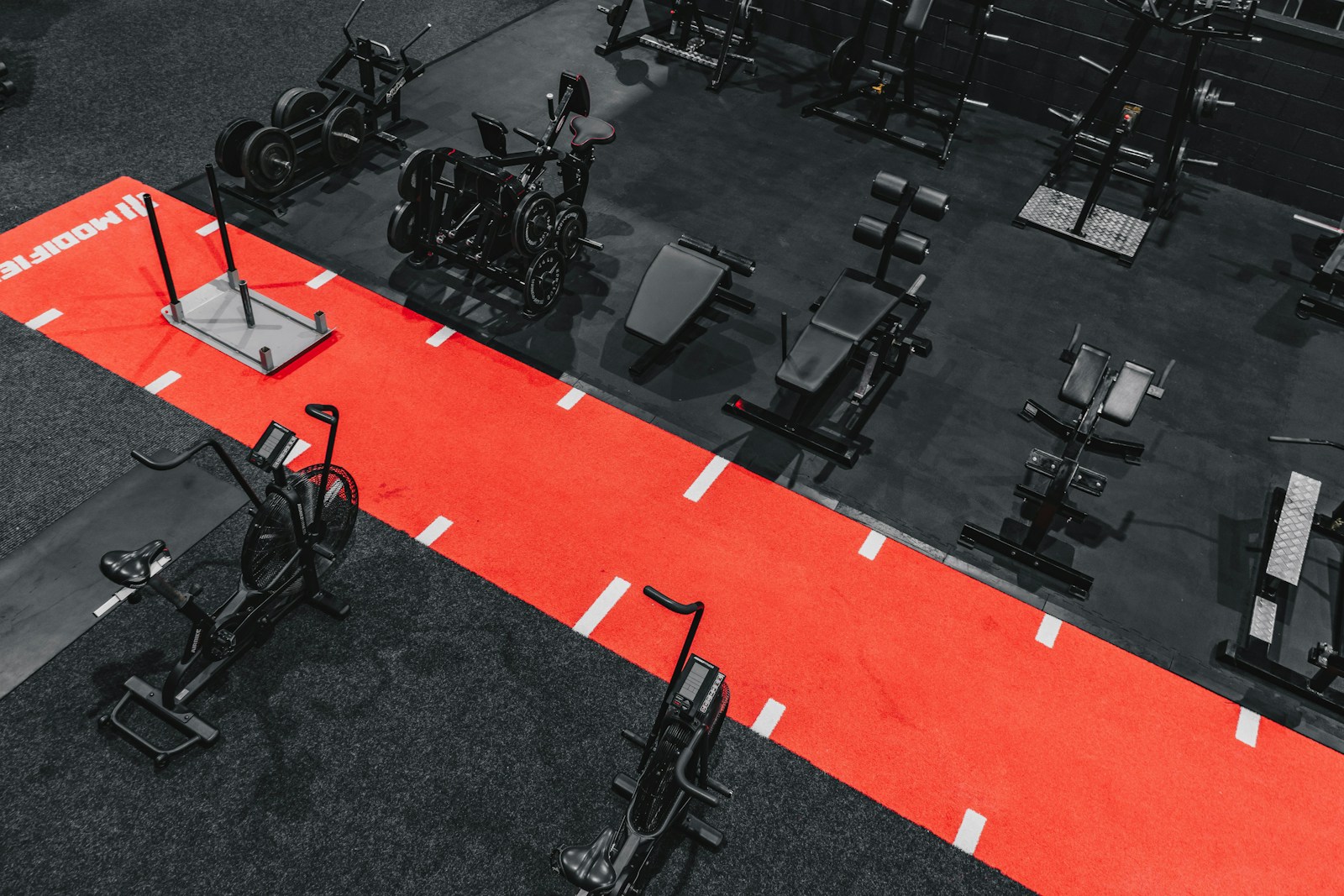 an overhead view of a gym with a red carpet